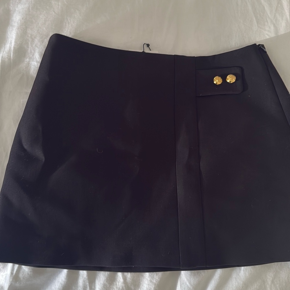NWT- Black mini skirt with gold buttons. Side zip